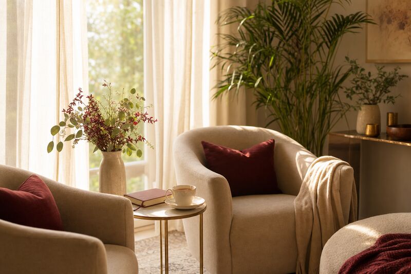 A warm, inviting gathering room with soft seating and natural light.